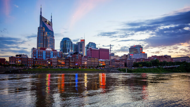 Nashville, Tennessee Cityscape Skyline Across The Cumberland River (logos blurred) nashville neighborhoods